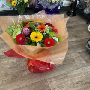 Vibrant hand tied aqua pack bouquet