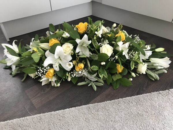 Yellow and white Casket tribute