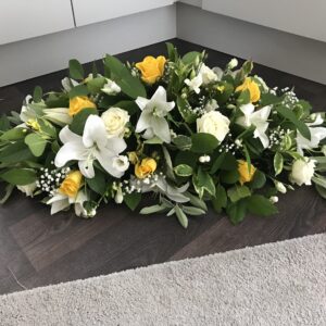 Yellow and white Casket tribute