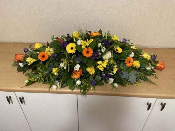 Purple, yellow and orange Casket tribute