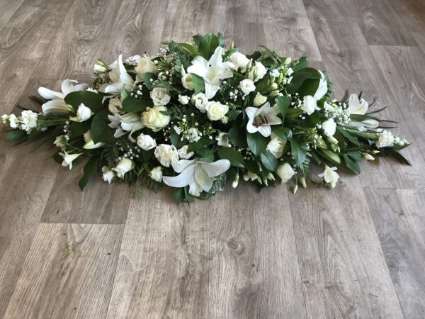 Cream, green and white casket tribute