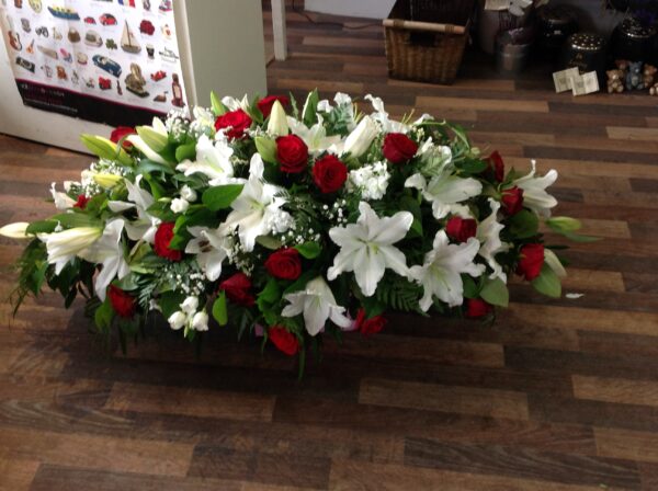 Red and white Casket tribute