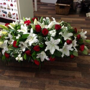 Red and white Casket tribute