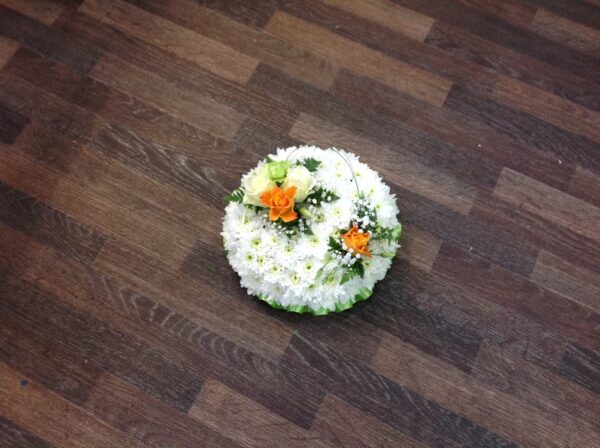 Orange and green on a white based posy